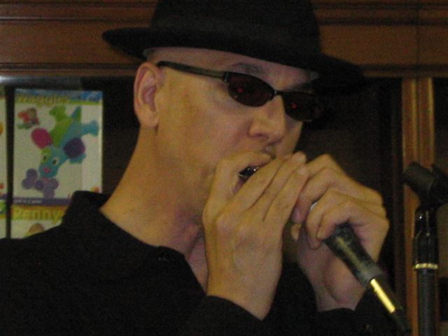 Mitch playing his soulful harmonica at one of our first shows...
