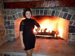 Emily Weaver posing by the fire
