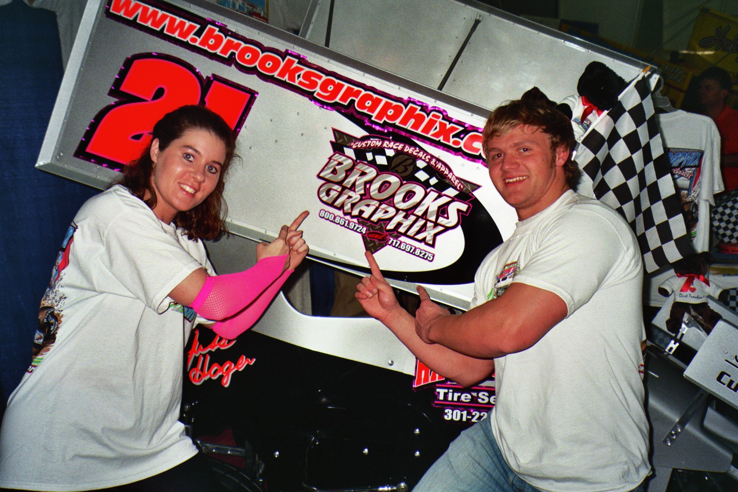 PWE wrestlers with the Brooks Grafix car
