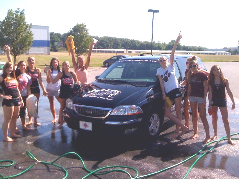 Mechanicsburg High School Cheerleaders with a clean Jazz Me van
